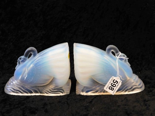 A pair of 1930's vaseline glass bookends sold£210