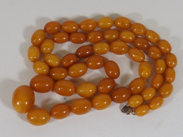 An amber bead necklace SOLD £1100