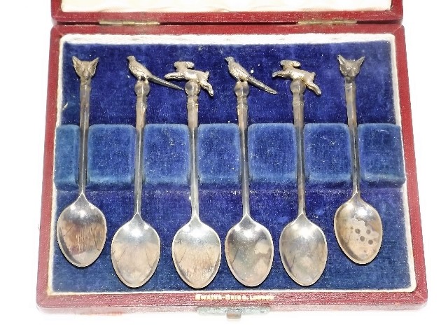 A set of six novelty silver teaspoons £110