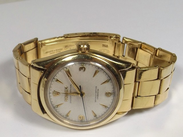 A gold Rolex watch £2500
