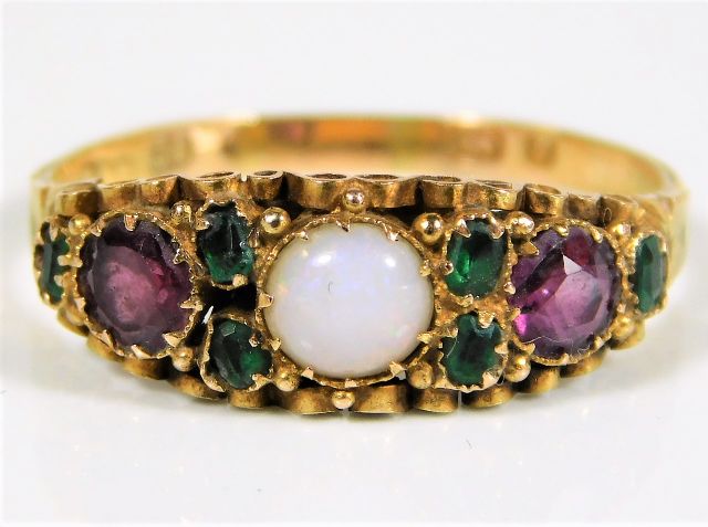 A 15ct gold ring with suffragette colours SOLD £360