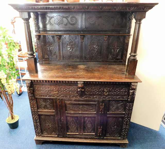 A 17thC. carved oak dresser with green man decor SOLD £520