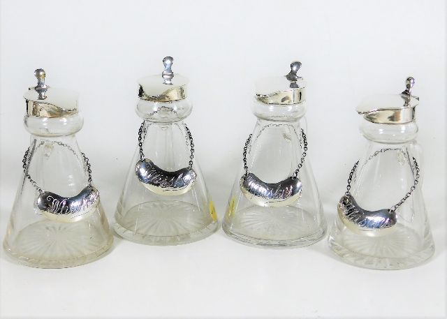 Four silver topped whisky noggins SOLD £330