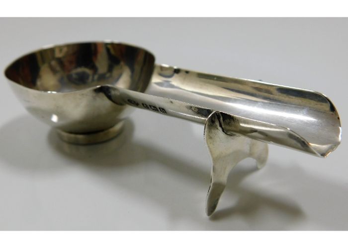 A 1907 Birmingham silver cigar ashtray spoon by William Hutton & Sons Ltd. SOLD £130