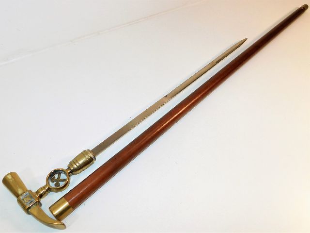 A gents malacca walking cane double bladed sword stick with brass fittings including a brass hammer handle 36.875in long SOLD £190