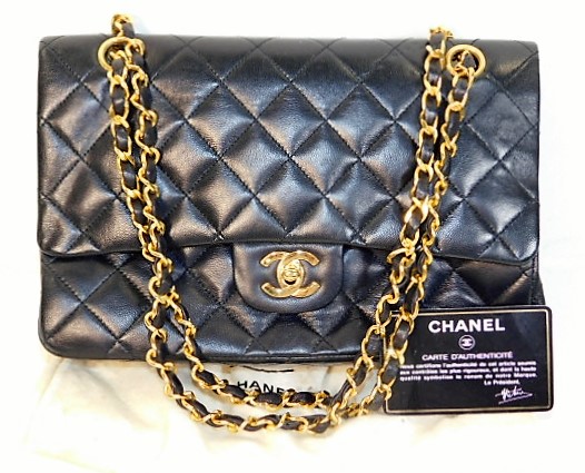 A ladies Chanel handbag with certificate card & original soft cover , minor faults SOLD £1400