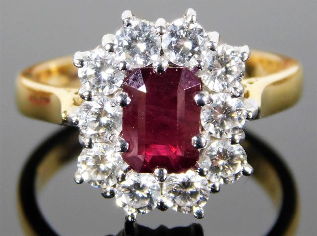 An 18ct gold ring set with 1.33ct of Burma ruby & approx. 1ct small diamonds 6.8g SOLD £740