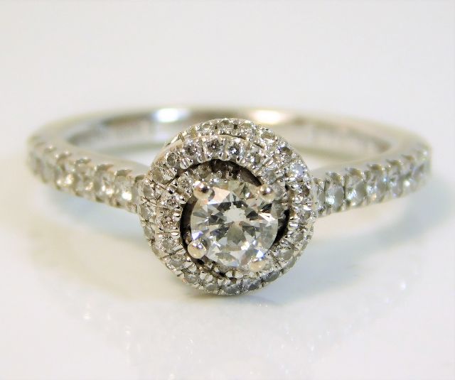An 18ct white gold Vera Wang ring set with 0.7ct diamonds & a sapphire under £500