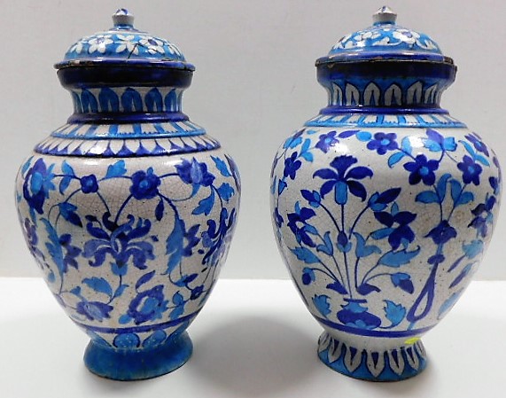 Two 19thC. lidded Persian earthenware jars, both lids af, repair to one rim. each approx. 15in tall SOLD £210