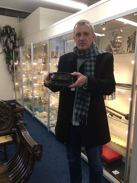 Auctioneer Paul Clark with bronze censer that sold for £38000